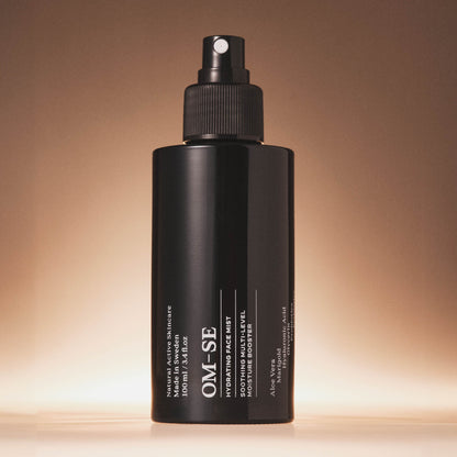 OM-SE Hydrating Face Mist bottle on a gradient brown background