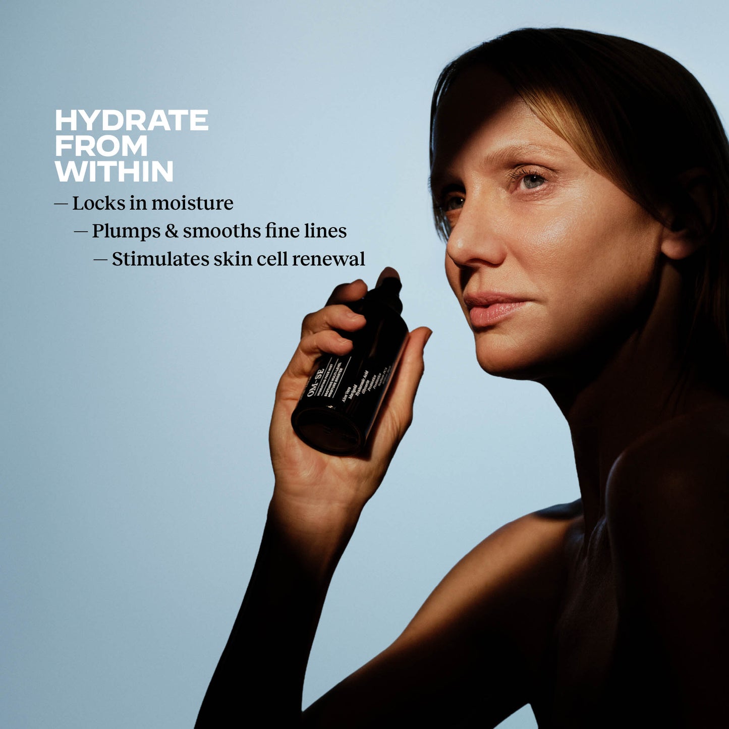 Woman holding an OM-SE Hydrating Face Mist with skin benefits text on blue background: hydrate from within, Locks in moisture, plumps and smooths fine lines, stimulates skin cell renewal.